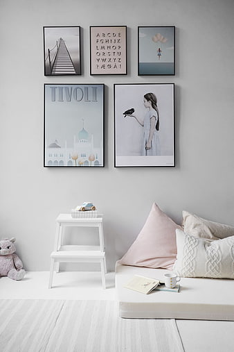 Scandinavian Nursery Interior with Wall Art and Soft Decor