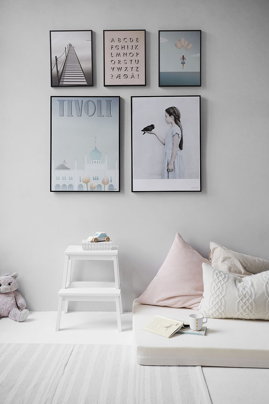 Scandinavian Nursery Interior with Wall Art and Soft Decor