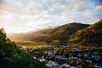 Sunlit Mountain Town Valley Landscape at Golden Hour