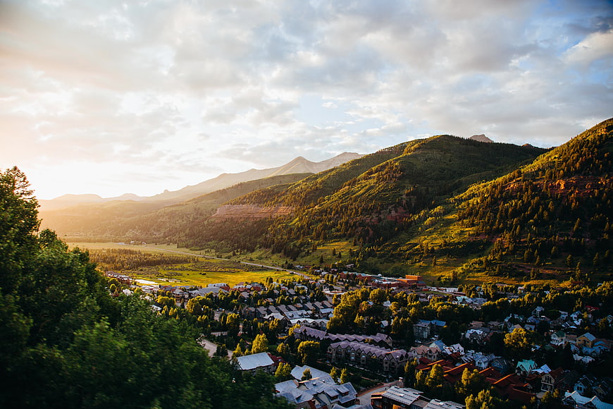 Sunlit Mountain Town Valley Landscape at Golden Hour