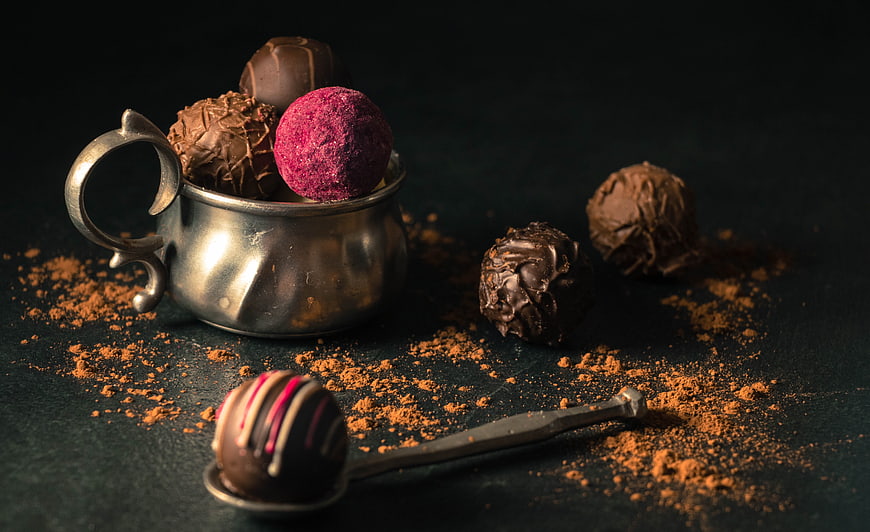 Gourmet Chocolate Truffles in Vintage Silver Cup with Cocoa Powder