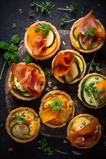 Overhead view of savory mini quiches with zucchini and prosciutto