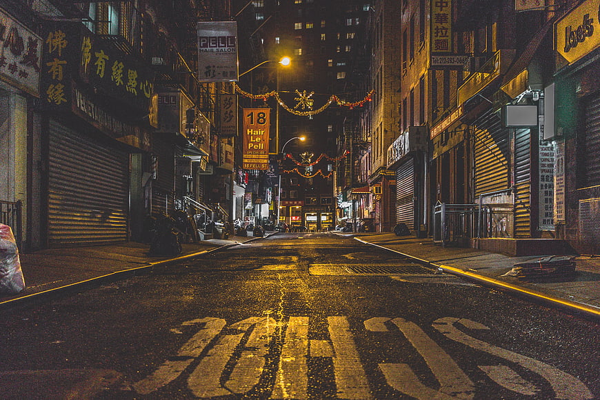 Empty Chinatown Street at Night with Wet Pavement