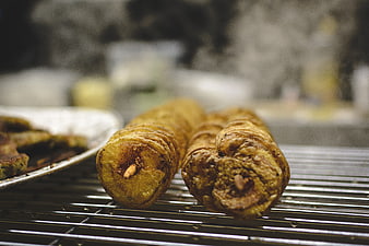 Close-up of fried potato twists on a wire rack