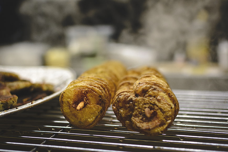 Close-up of fried potato twists on a wire rack