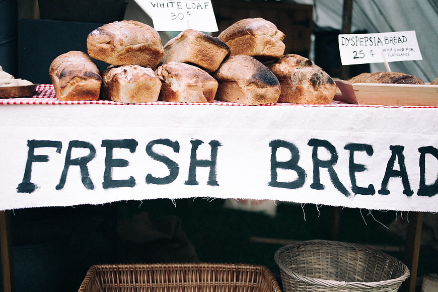 Rustic Fresh Bread Market Stall with Hand-Painted Sign