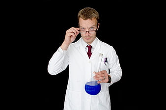 Scientist in Lab Coat Holding Blue Liquid Flask