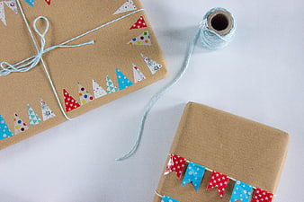 Creative Gift Wrapping With Kraft Paper, Bunting Tape, And Twine