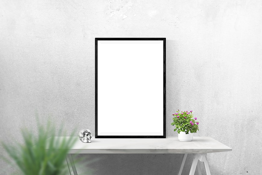 Minimalist black picture frame mockup on white console table