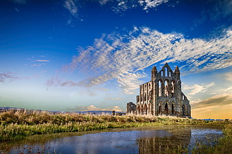 Whitby Abbey Ruins Reflection in Water Under Blue Sky