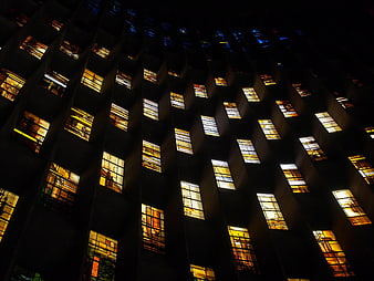 Illuminated Stained Glass Windows in Dark Cathedral Interior