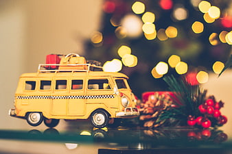 Yellow Toy Van with Christmas Lights and Pine Cones