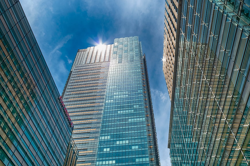 Low angle view of modern glass skyscrapers in Tokyo, Japan