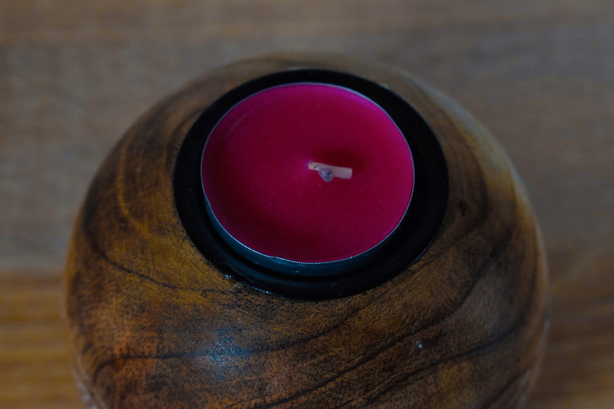 Top View of Pink Tea Light Candle in Wooden Holder