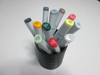 Collection of Copic Markers in a Black Holder