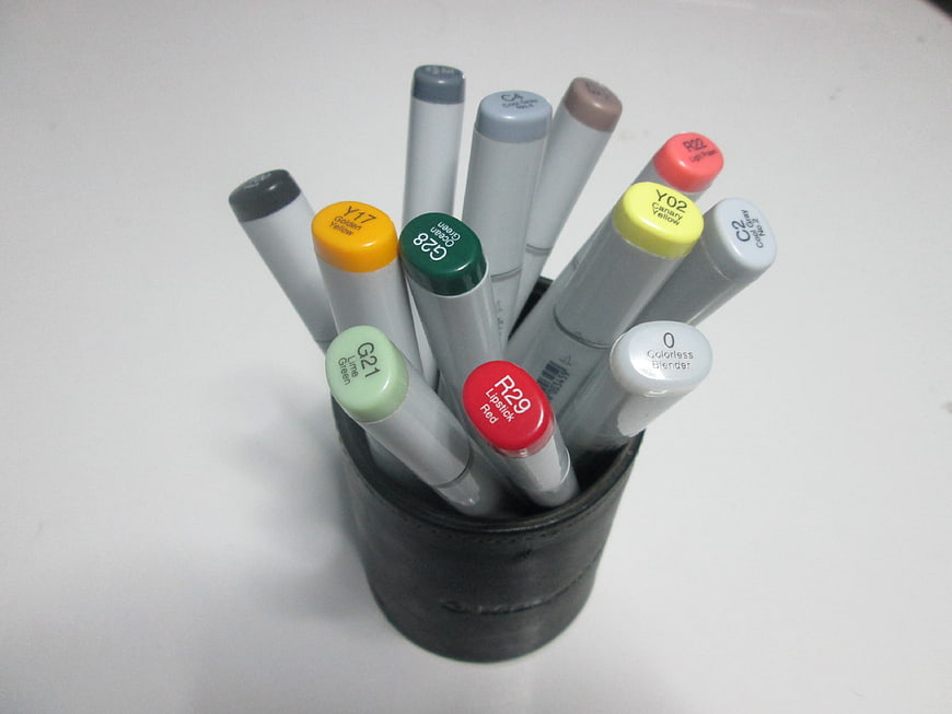 Collection of Copic Markers in a Black Holder