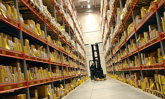 Warehouse Aisle With Forklift And Tall Storage Racks