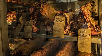 Cured Iberian Ham Legs in Charcuterie Display Case