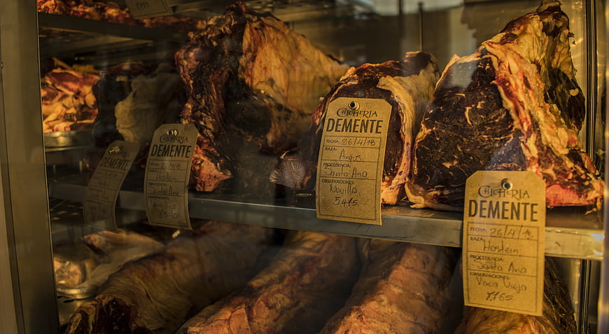 Cured Iberian Ham Legs in Charcuterie Display Case