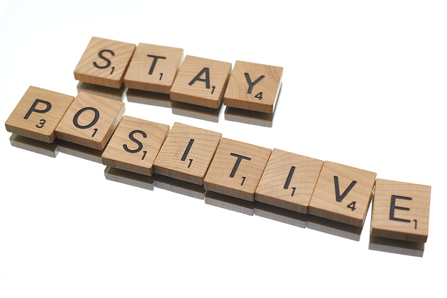Stay Positive Wooden Scrabble Tiles on White Background