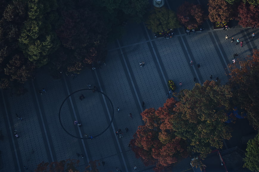 Aerial View of Autumn Park Plaza with Walking People