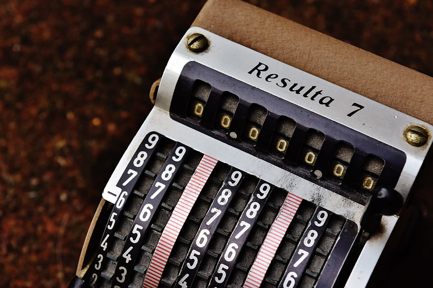 Close-up of vintage Resulta 7 mechanical calculator with numbered dials