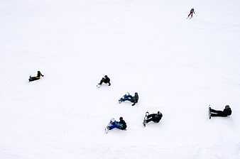 High Angle View of Snowboarders Resting on White Slope