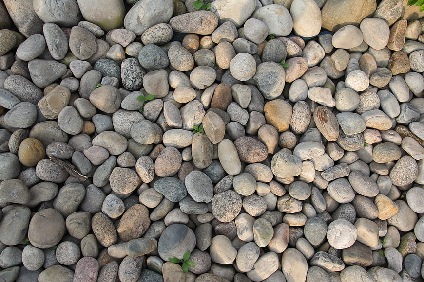 Top View of Smooth River Stones and Pebbles Texture
