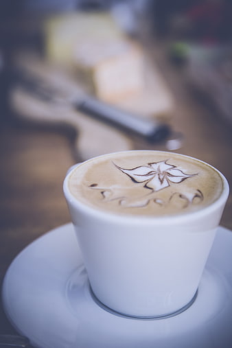 Close-up of Latte Art in White Cup with Blurred Background