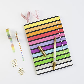 Colorful Striped Notebook Flat Lay with Stationery