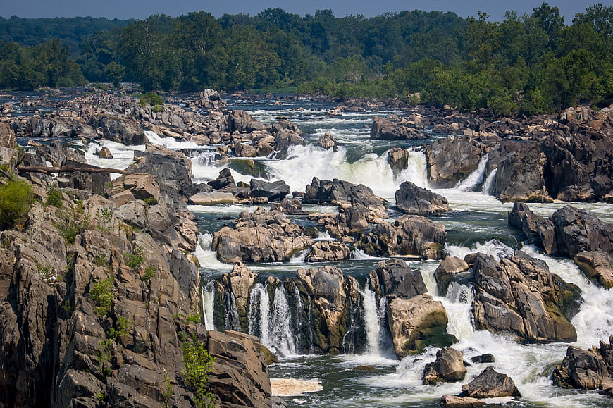 Scenic Rocky River Rapids and Waterfalls in Summer Forest