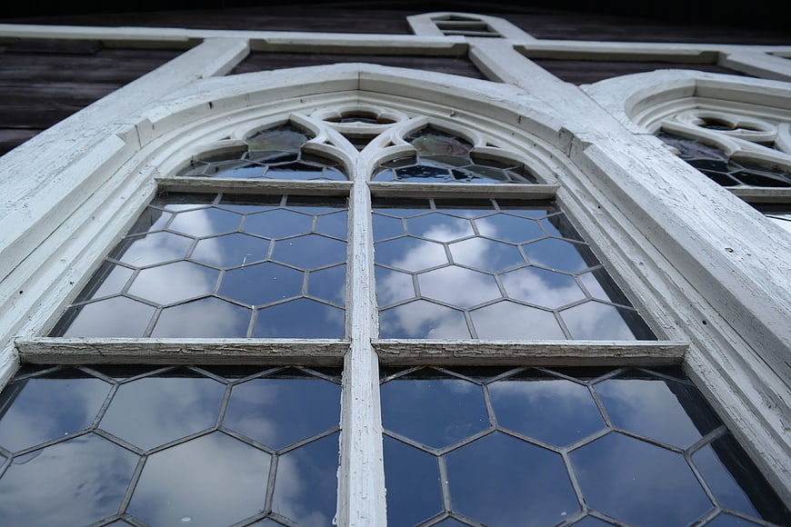 Close-up of Gothic church window with hexagonal glass panes
