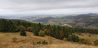 Panoramic view of rolling hills and forest in autumn