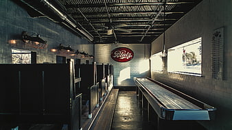 Vintage Shuffleboard Table in Industrial Bar Interior