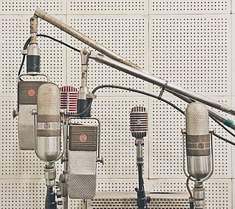 Vintage Microphones on Perforated Studio Wall