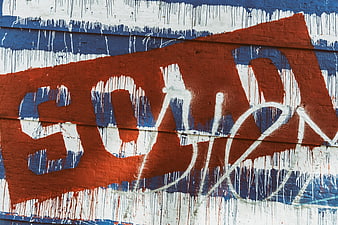 Red, White, and Blue Graffiti on a Wall
