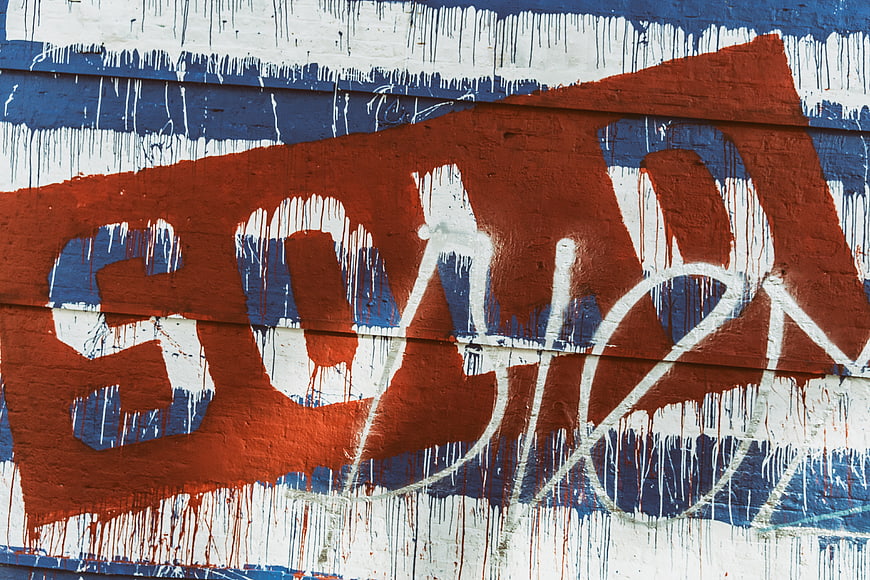 Red, White, and Blue Graffiti on a Wall