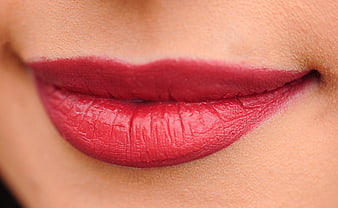 Close-up of red lips with matte makeup on fair skin