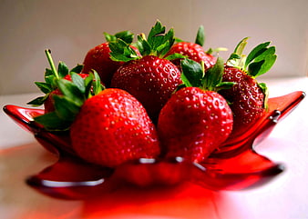 Fresh Red Strawberries in a Red Glass Bowl
