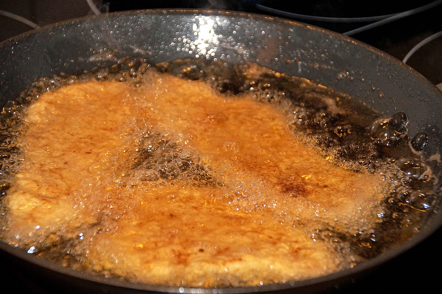 Breaded Pork Cutlet Frying In Hot Oil In A Pan