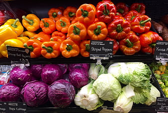 Colorful Bell Peppers and Cabbage in Grocery Store Display
