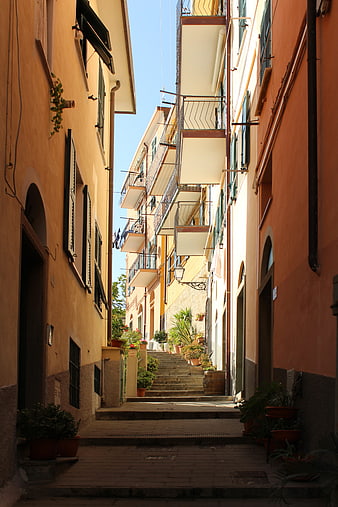Narrow Italian Street with Colorful Buildings and Stairs