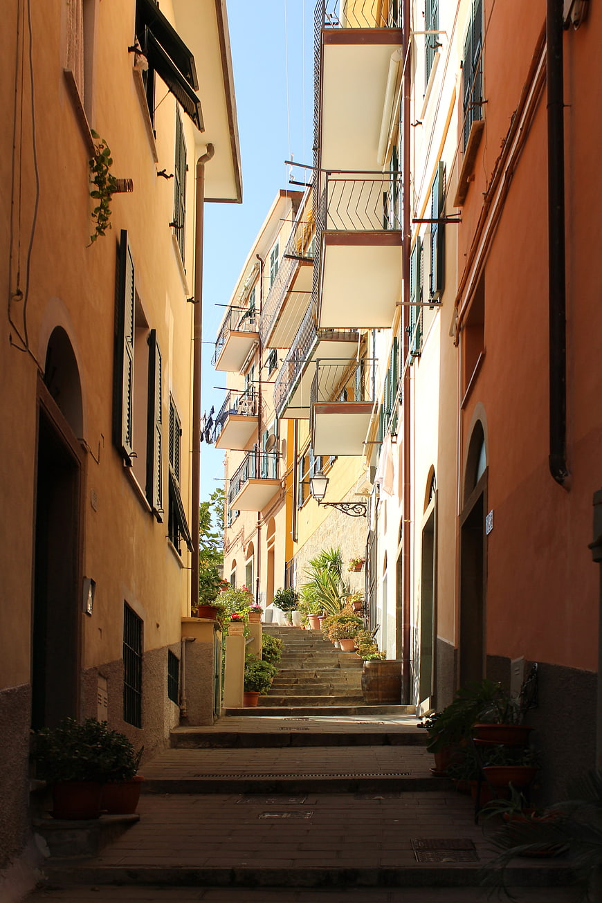 Narrow Italian Street with Colorful Buildings and Stairs