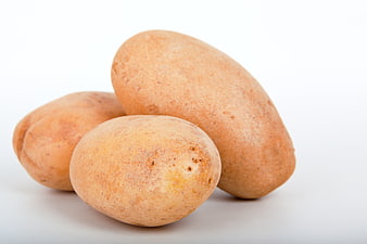 Fresh raw potatoes isolated on white background