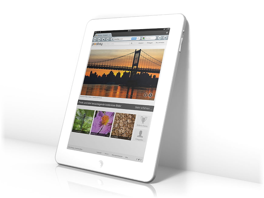 White tablet computer displaying website on white background