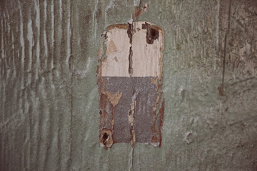 Weathered wood texture with peeling paint layers
