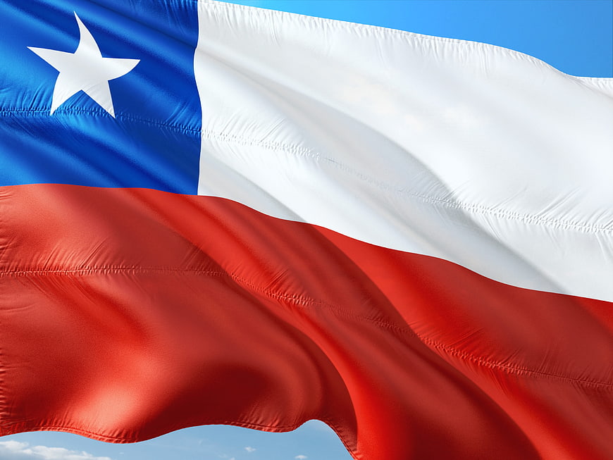 Chilean National Flag Waving Against Blue Sky