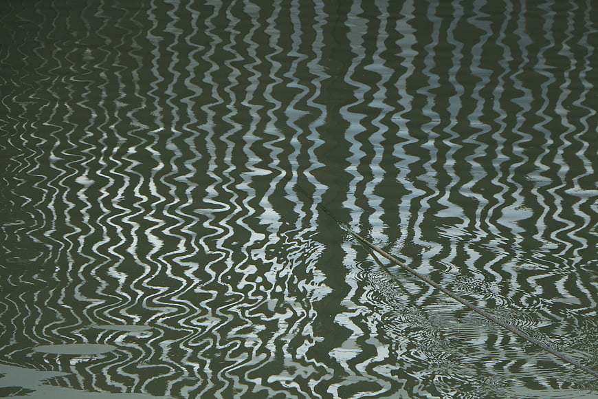 Abstract water surface ripples and reflections background