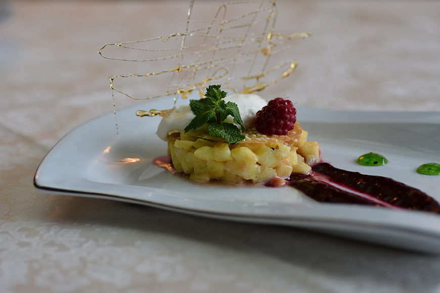 Elegant Gourmet Dessert with Raspberry and Mint Garnish