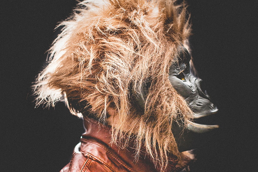 Man in Gorilla Mask and Leather Jacket Profile